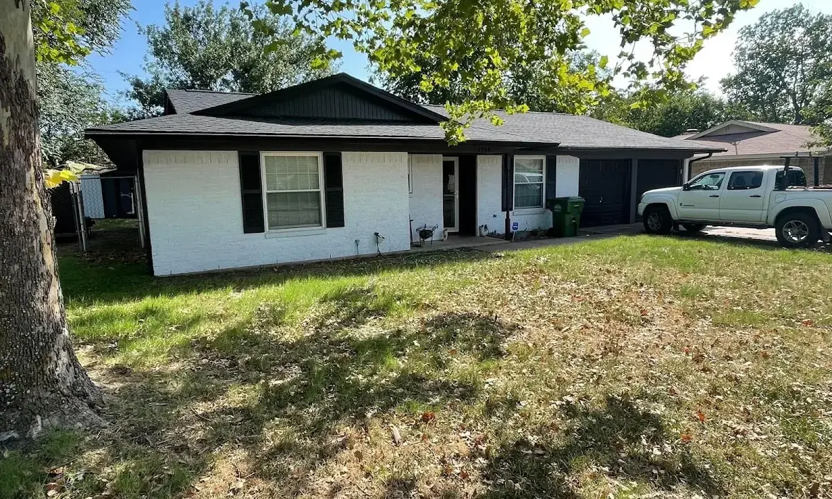 Professional roofing crew working on a residential roof in Scarborough